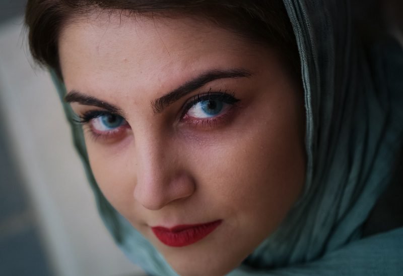 Eye Makeup Ideas for Blue Eyes Over 40 Woman with Hijab Scarf Looking at the Camera with Blue Eyes